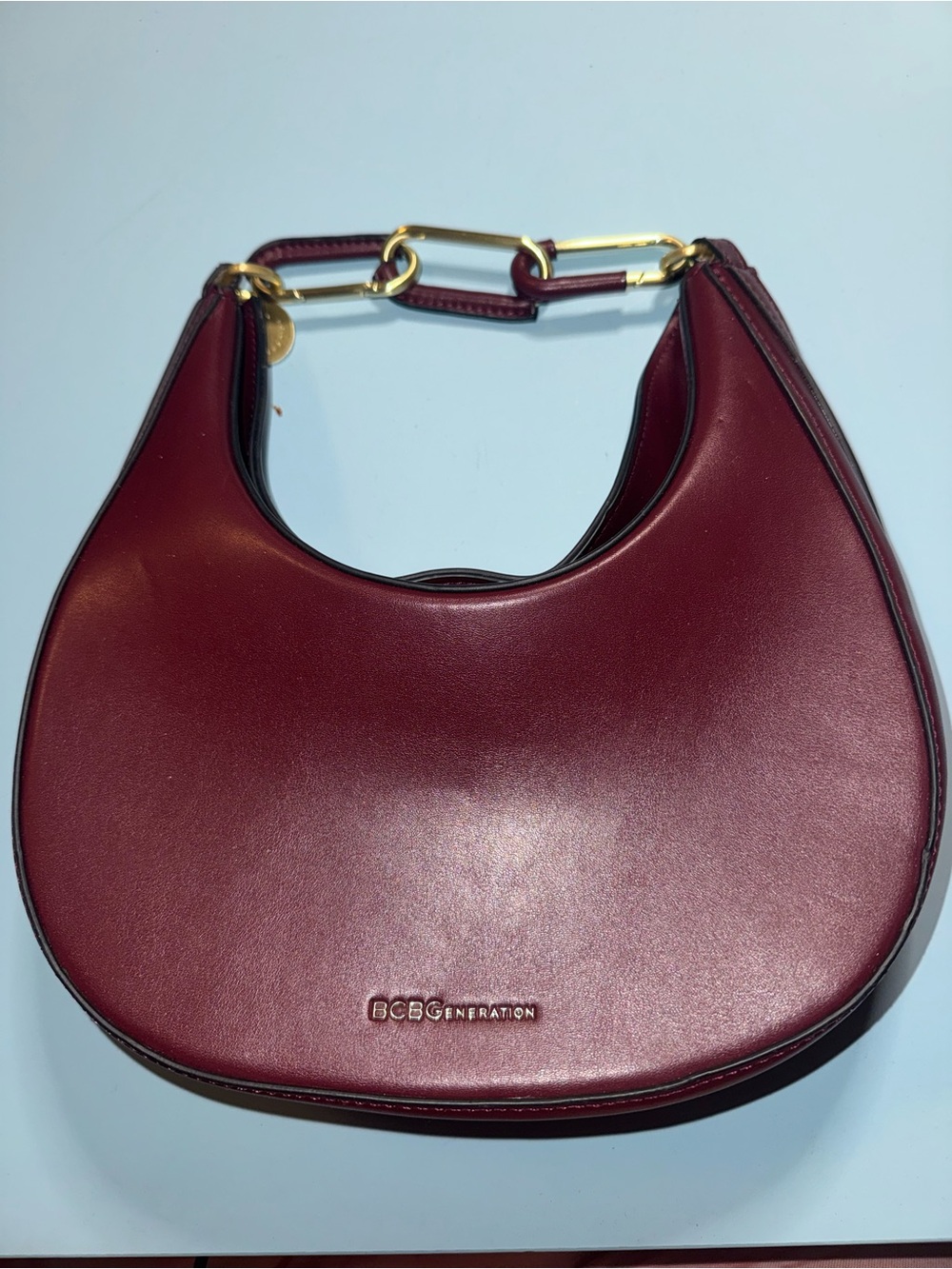 BCBGeneration Burgundy Crescent Shoulder Bag with Gold Chain